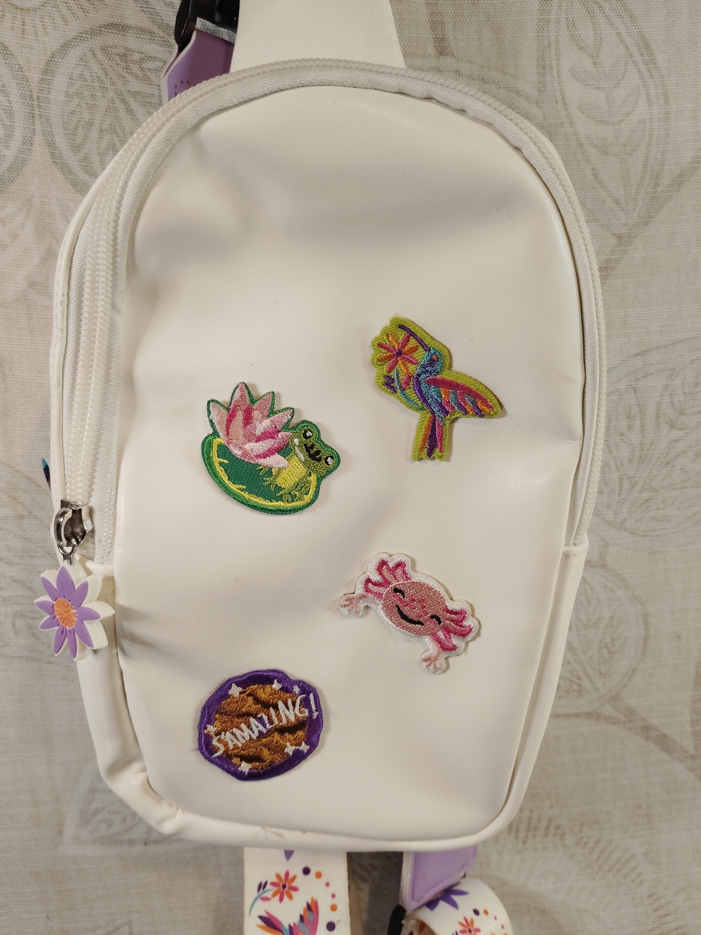Own Your Magic Kids White Sling Bag with Colorful Patch Accents